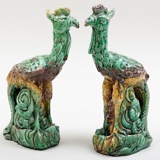 Pair of Chinese Green Ochre and Aubergine Glazed Earthenware Models of Phoenix