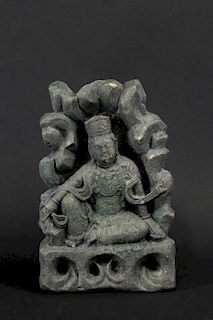 A Carved Stone Figure of Seated Guanyin.