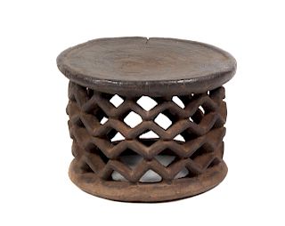 A Bamileke Carved Wood Stool
Height 12 x diameter 17 1/2 inches.