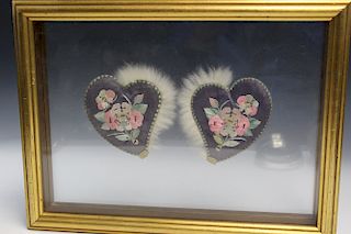 A pair of Chinese embroidery ear muffs. framed.