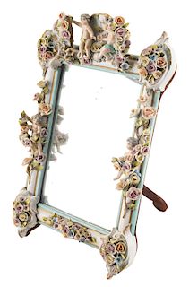 A MIDCENTURY TABLE MIRROR WITH SOFT-PASTE DRESDEN FRAME