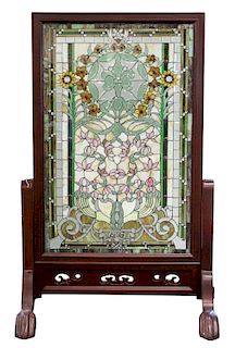 A CONTEMPORARY STAINED GLASS FIRE SCREEN WITH WOODEN FRAME