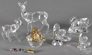 Swarovski crystal figures, to include two butterflies, two deer, a swan, and a secrets set