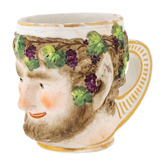 A RUSSIAN PORCELAIN CUP IN THE FORM OF THE HEAD OF BACCHUS, GARDNER PORCELAIN FACTORY, VERBILKI, MOSCOW, 1780S-1790S