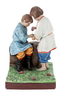 A RUSSIAN PORCELAIN FIGURAL GROUP OF CHILDREN WITH EASTER EGGS, GARDNER PORCELAIN FACTORY, VERBILKI, MOSCOW, 1870S-1890S