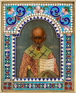 A RUSSIAN TRAVELING ICON OF ST. NICHOLAS THE WONDERWORKER WITH IMPORTED GILT SILVER AND CLOISONNE ENAMEL FRAME, MOSCOW, 1908-1917
