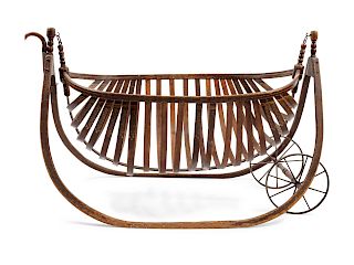 American Field Cradle With a Canoe-Shaped Slat Basket Hanging on Bentwood Holders
height 27 1/2 x length 46 x width 23 3/4 inches