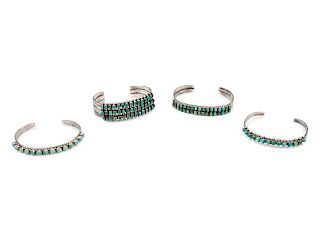 Four Zuni Silver and Turquoise Cuff Bracelets
largest length 5 1/4 x opening 1 1/4 x width 7/8 inches