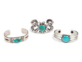 Three Navajo Silver and Turquoise Cuff Bracelets
largest length 5 1/4 x opening 1 1/4 x width 1 3/8 inches