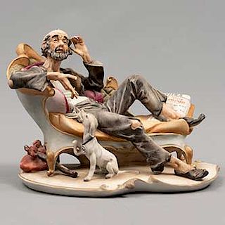 Anciano con perro. Origen europeo. Siglo XX. Estilo Capodimonte. Elaborado en porcelana. Acabado gres. 17 x 23 x 16 cm.