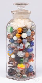 Collection of antique marbles in a glass jar