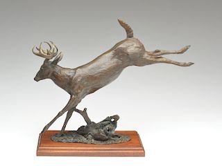 Bronze sculpture of a stag leaping over a log, Bill Turner.