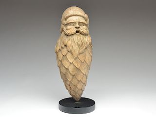 Wooden carving of a Santa Claus.