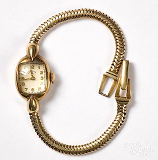 Lady Elgin 14K gold wristwatch.