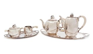 Holger Rasmussen
(Danish, 20th Century)
Coffee and Tea Service, c. 1945ComprisingTeapotCoffee PotCovered SugarCreamerLarge Serving TraySmall Serving T