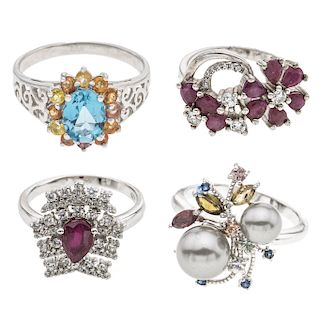 Lote de cuatro anillos y pulsera, elaborados en plata. decorados con cuarzos, rubies y sintéticos.
