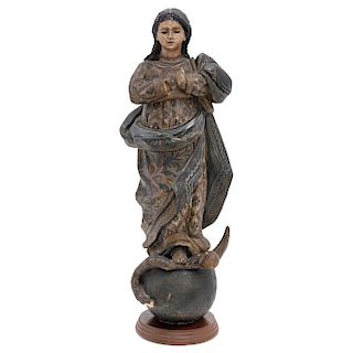 IMMACULATE VIRGIN. MEXICO, EARLY 20TH CENTURY. Carved and polychromed wooden figure with eye glass aplications. 15.5 in tall.