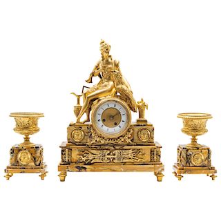 GARNITURE. FRANCE, 20TH CENTURY. Sienna marble and gilded bronze. 17.5 in maximum height.