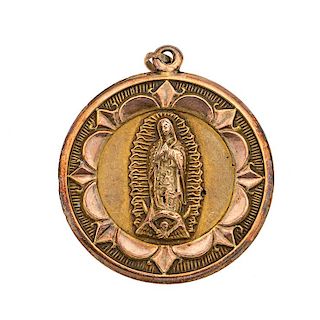 Medalla rellena en oro amarillo de 8k. Imagen de Virgen de Guadalupe y Divino rostro. Peso: 11.4 g.