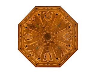 An Italian Marquetry Inlaid and Ebonized Octagonal Center Table
Height 29 3/4 x diameter 54 inches.