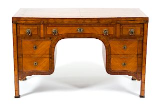 An Italian Neoclassical Inlaid Satinwood Desk
Height 29 x width 46 x depth 24 3/4 inches.