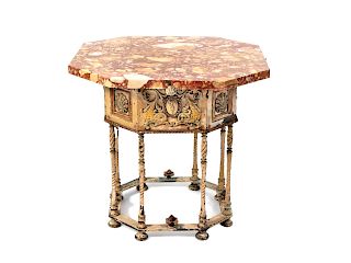 A Painted and Parcel Gilt Metal Base Table
Height 22 1/2 x width 24 x depth 24 inches.