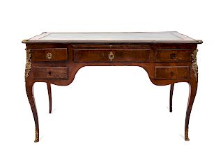 A Louis XV Style Tulipwood Writing Table
Height 32 x width 52 1/2 x depth 31 inches.