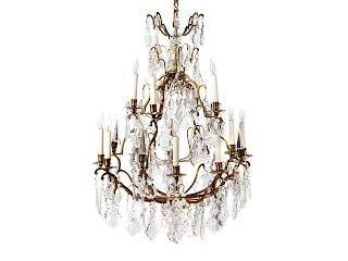 A Louis XV Style Gilt Bronze and Cut Crystal Chandelier
Height 36 x diameter 26 inches.