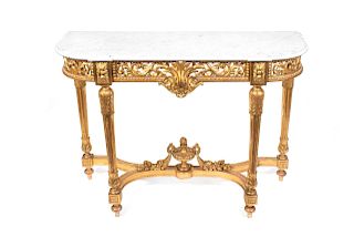 A Louis XVI Style Carved Giltwood Console Table
Height 38 1/4 x width 52 1/2 x depth 18 3/4 inches.