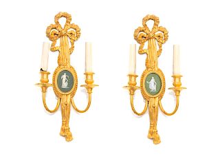 A Pair of Louis XVI Gilt Wood and Wedgwood Mounted Sconces
Height 22 1/2 x width 10 1/2 x depth 5 inches.