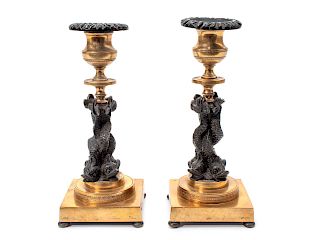 A Pair of French Gilt Bronze and Ebonized Figural Candlesticks
Height 8 inches.