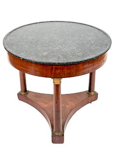 A French Empire Gilt Metal Mounted Marble Top Walnut Center Table
Height 29 1/2 x diameter 35 inches.