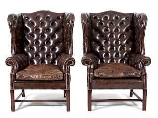 A Pair of George II Brown Leather Upholstered Wing ChairsHeight 32 inches.