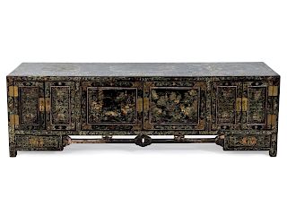 A Chinese Black Lacquer Low Cabinet
Height 19 1/4 x length 60 3/4 x depth 15 1/2 inches.