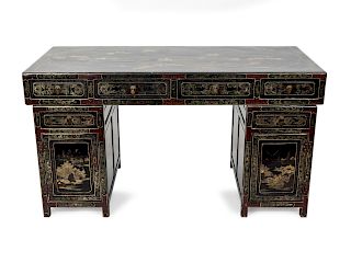 A Chinese Black Lacquer and Parcel Gilt Decorated Pedestal Desk
Height 33 x width 60 x depth 27 1/2 inches.