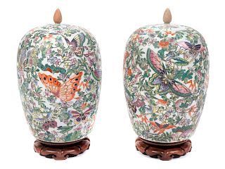A Pair of Chinese Famille Rose Porcelain Covered Jars
Height 14 x diameter 9 inches.