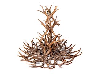 A Faux Antler Nine-Light Chandelier
Height 48 x diameter 58 inches.
