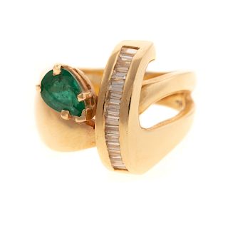 A Ladies Emerald & Diamond Ribbon Ring in 14K