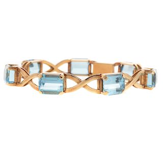 A Ladies Blue Topaz "X" Link Bracelet in 18K