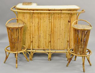Three piece bamboo set, bar and two bar stools, mid-20th century. ht. 41 1/2 in., lg. 59 in.