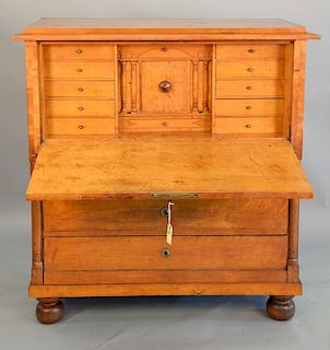 Cherry secretary abattant with drawered interior on bun feet, early 19th century. ht. 49 1/2 in., wd. 47 1/2 in.
