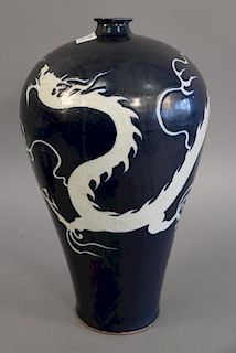 Blue glazed dragon vase having deep blue glaze with white three claw dragon. ht. 16 1/2 in.