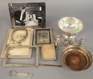 Sterling silver lot to include six sterling silver frames plus revere bowl, pepper shakers, and wine coaster with wood bottom. 16 t oz. plus four fram