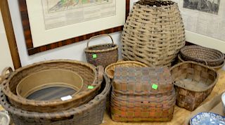 Group of baskets to include two coil Indian baskets, two paint decorated baskets with cover along with five various baskets.