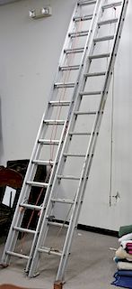 Two aluminum extension ladders.