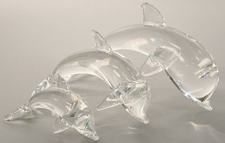 Set of three Steuben porpoises, crystal dolphin sculptures in three different sizes. lg. 7 in., 9 in., & 12 in.