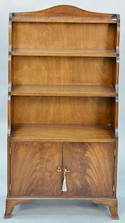 George IV style mahogany bookcase with two door base, ht. 50 in., wd. 26 in.