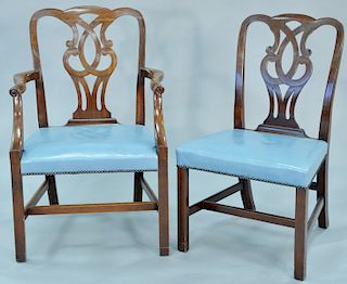 Set of seven custom mahogany Chippendale style dining chairs, five side chairs, two armchairs, all with blue leather over upholstered seats, possibly 