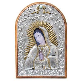 Icono. Beli. Virgen de Guadalupe. Firmado y fechado '96. Repujado en lámina sobre madera. Decorada con simulantes de color. 33 x 23 cm.