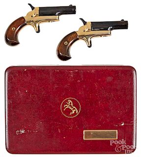 Pair of Colt single shot side lever pistols